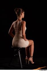 Sitting reference of whole body white dress white heels Little Caprice